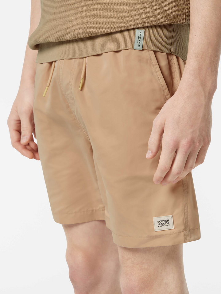 Solid mid-length swim shorts